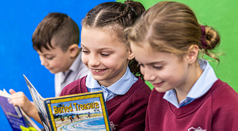 Chisholm Catholic Primary Bligh Park students reading in the library