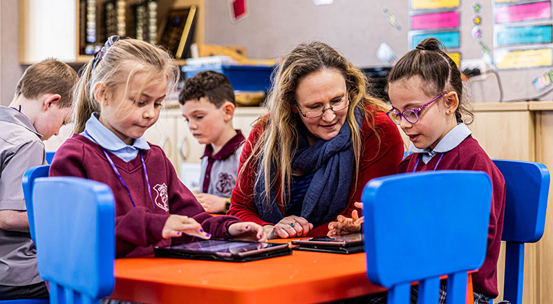 Teacher with students at Chisholm Catholic Primary Bligh Park