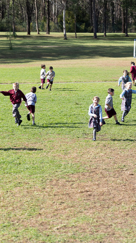 Chisholm Primary Bligh Park students playing on sports field