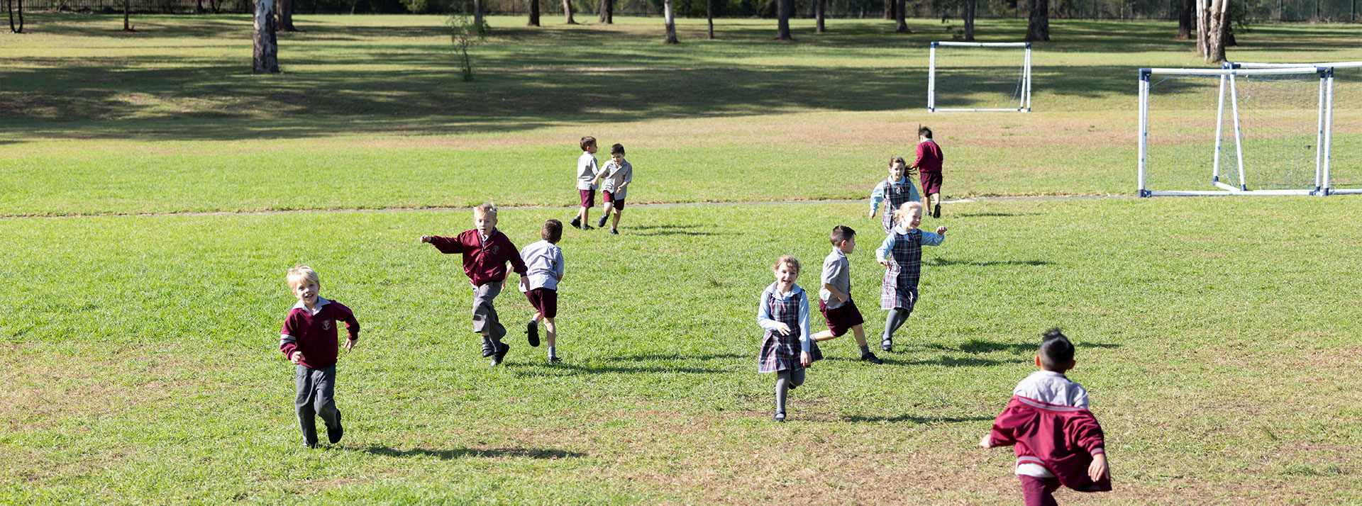 Chisholm Primary Bligh Park students playing on sports field