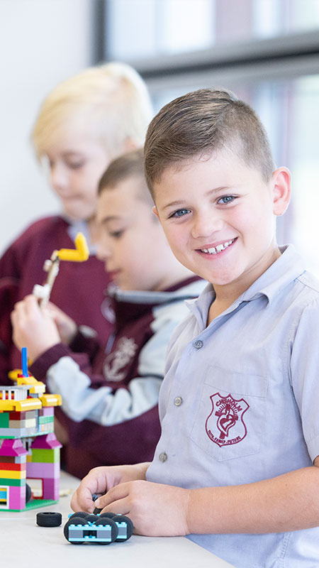 Students in class, they are creating a project with building-blocks