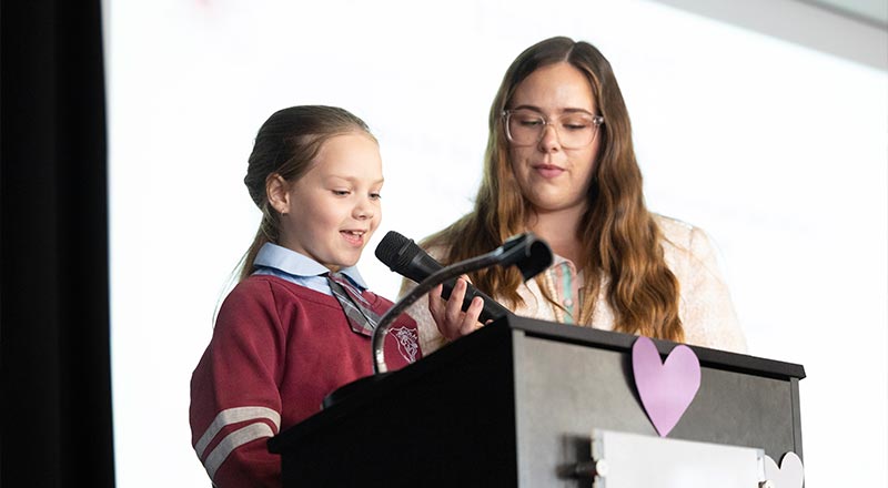 Chisholm Primary Bligh Park student speaking into microphone