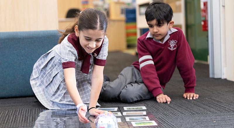 Students playing with educational toy