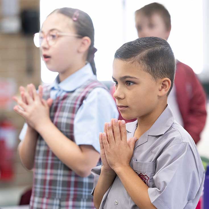 Three students praying